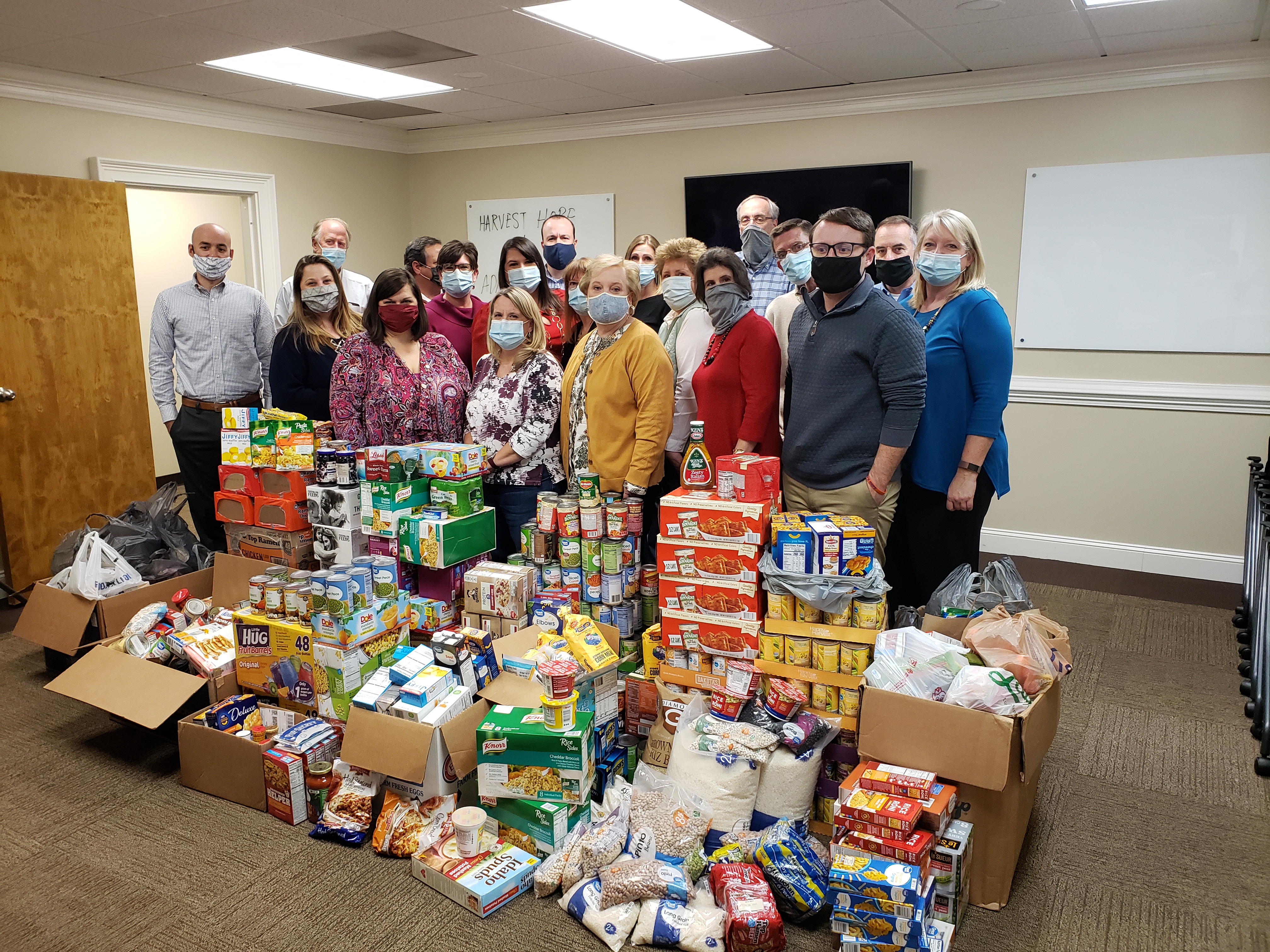 AEA Employees standing with Food Drive Donations